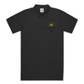 Unisex Chad Polo in Black with Fragfitti™ crown embroidery, front view.